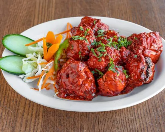Butter Chicken Poutine at Chef Paaji — signature Indian-Canadian fusion in Winnipeg, MB