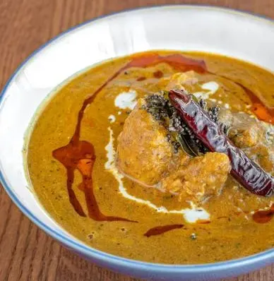 Indian chicken curry with dried red chillies at Chef Paaji Winnipeg